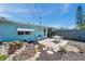 Quaint backyard with a patio, landscaping, and lovely architectural details at 3307 Maitland Dr, Holiday, FL 34691