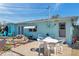 Cozy backyard features a patio, well-kept landscaping, and the home's exterior at 3307 Maitland Dr, Holiday, FL 34691