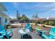 Charming backyard with well-maintained garden areas and various seating arrangements at 3307 Maitland Dr, Holiday, FL 34691