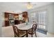 Inviting dining area with access to the backyard, adjacent to the modern kitchen at 3307 Maitland Dr, Holiday, FL 34691