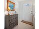 Hallway with a dresser, lamp, art and front door at 3307 Maitland Dr, Holiday, FL 34691