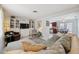 Bright living room featuring neutral colors, comfortable seating, and open layout to kitchen at 3307 Maitland Dr, Holiday, FL 34691