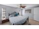 Well-lit bedroom boasts a ceiling fan and several windows for ample natural light at 3370 Harbor Lake Dr, Largo, FL 33770