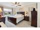Comfortable bedroom featuring a large window for natural light and elegant furnishings at 3876 Timber Ridge Ct, Palm Harbor, FL 34685