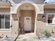 Inviting entryway with arched doorway and a stylish white front door at 3876 Timber Ridge Ct, Palm Harbor, FL 34685