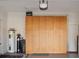 Spacious garage with ample storage cabinets, water heater, and water filtration system at 3876 Timber Ridge Ct, Palm Harbor, FL 34685