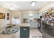 Kitchen with an island and stainless steel appliances at 3876 Timber Ridge Ct, Palm Harbor, FL 34685