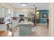 Eat-in kitchen features stainless steel appliances and an island at 3876 Timber Ridge Ct, Palm Harbor, FL 34685