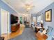 Spacious living room with a light blue walls, carpet, and wood flooring at 3876 Timber Ridge Ct, Palm Harbor, FL 34685