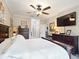 Bright main bedroom features a ceiling fan and an ensuite bathroom at 3876 Timber Ridge Ct, Palm Harbor, FL 34685