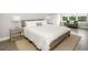 This main bedroom features a large window, sitting area, and two nightstands at 4043 Rocky Shores Dr, Tampa, FL 33634