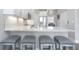 The kitchen features stainless steel appliances, white cabinets, granite countertops and an eat-in bar with seating at 4043 Rocky Shores Dr, Tampa, FL 33634