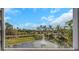 Scenic view of a pond with fountain and palm trees, providing a serene outdoor living atmosphere at 4043 Rocky Shores Dr, Tampa, FL 33634