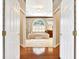 Bathroom with large tub, neutral wallpaper, and tile floor at 407 S West Shore Blvd, Tampa, FL 33609