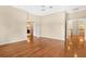 Spacious bedroom with gleaming hardwood floors and multiple doorways at 407 S West Shore Blvd, Tampa, FL 33609