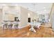 Elegant dining room features hardwood floors, stylish chandelier, a marble countertop, and counter seating at 407 S West Shore Blvd, Tampa, FL 33609