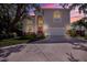 Stunning two-story home with a grand entrance, arched windows, and a well-maintained driveway and lawn at 407 S West Shore Blvd, Tampa, FL 33609