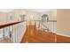 Bright hallway features hardwood floors, staircase with wood railing, and natural light from large windows at 407 S West Shore Blvd, Tampa, FL 33609