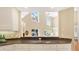 Kitchen view featuring granite countertops, white cabinetry and bar top with view into living room at 407 S West Shore Blvd, Tampa, FL 33609
