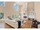 Bright and airy living room with a fireplace, built-in cabinets, and white leather seating with hardwood flooring at 407 S West Shore Blvd, Tampa, FL 33609