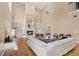 Spacious living room with vaulted ceilings, hardwood floors, fireplace, and bright natural light at 407 S West Shore Blvd, Tampa, FL 33609