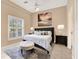 Cozy main bedroom with a queen-size bed, decorative pillows, and a neutral color palette at 407 S West Shore Blvd, Tampa, FL 33609