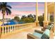 Inviting balcony with comfortable seating offering breathtaking waterfront views and tranquil ambiance at 436 St Andrews Dr, Belleair, FL 33756
