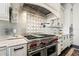 Gourmet kitchen featuring high-end stainless steel appliances and custom cabinetry, for the discerning chef at 436 St Andrews Dr, Belleair, FL 33756