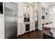 Gourmet kitchen boasts stainless steel appliances and custom cabinetry with a wine fridge and built-in coffee maker at 436 St Andrews Dr, Belleair, FL 33756