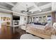 Spacious main bedroom with fireplace, sitting area, and serene water view at 436 St Andrews Dr, Belleair, FL 33756