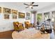 Sitting room with walls adorned with paintings and large windows offering a picturesque view at 436 St Andrews Dr, Belleair, FL 33756