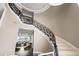 Grand staircase with ornate iron railings and a marble finish, offering elegant architectural detail at 436 St Andrews Dr, Belleair, FL 33756