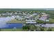 Aerial view of a waterfront community featuring canals, docks, and beautifully landscaped homes at 5616 Seagrass Pl, Apollo Beach, FL 33572