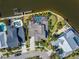 Aerial view of waterfront home with screened pool, boat dock, and manicured backyard at 5616 Seagrass Pl, Apollo Beach, FL 33572