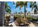 View of the landscaped backyard with canal access and waterfront views at 5616 Seagrass Pl, Apollo Beach, FL 33572