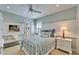 Cozy bedroom featuring beachy decor, a comfortable bed, and plenty of natural light at 5616 Seagrass Pl, Apollo Beach, FL 33572
