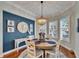 Breakfast nook featuring a chandelier, a round wooden table, and light-filled windows at 5616 Seagrass Pl, Apollo Beach, FL 33572