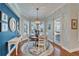 Breakfast nook with lots of natural light and an elegant chandelier at 5616 Seagrass Pl, Apollo Beach, FL 33572