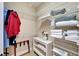 Closet with white shelving, containing towels and linens at 5616 Seagrass Pl, Apollo Beach, FL 33572