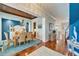 Elegant dining room featuring hardwood floors, stylish lighting, and an open layout at 5616 Seagrass Pl, Apollo Beach, FL 33572