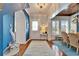 Elegant foyer with hardwood floors, stylish lighting, and decorative accents at 5616 Seagrass Pl, Apollo Beach, FL 33572