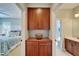 Hallway between bedroom and bath featuring custom cabinets for extra storage at 5616 Seagrass Pl, Apollo Beach, FL 33572
