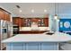 Spacious kitchen featuring stainless steel appliances, large center island, and ample cabinet space at 5616 Seagrass Pl, Apollo Beach, FL 33572