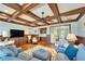 Open living area with coffered ceiling, comfortable seating, and natural light, perfect for relaxation at 5616 Seagrass Pl, Apollo Beach, FL 33572