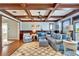 Cozy living room with detailed coffered ceilings, comfortable furnishings, and hardwood floors at 5616 Seagrass Pl, Apollo Beach, FL 33572