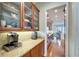 Long kitchen pantry lined with shelving at 5616 Seagrass Pl, Apollo Beach, FL 33572