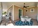 Outdoor patio with wicker furniture and ceiling fan, ideal for enjoying outdoor living at 5616 Seagrass Pl, Apollo Beach, FL 33572