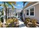 Inviting screened-in pool area with lush landscaping and a serene outdoor living space at 5616 Seagrass Pl, Apollo Beach, FL 33572