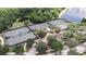 Aerial view of well-maintained community tennis courts surrounded by lush greenery at 5616 Seagrass Pl, Apollo Beach, FL 33572