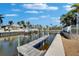 Picturesque waterfront view showcasing a private dock and serene canal waters at 5616 Seagrass Pl, Apollo Beach, FL 33572